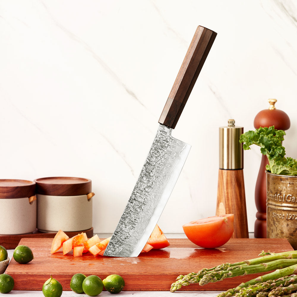 Kitchen knife with wooden handle on a cutting board with vegetables and fruits