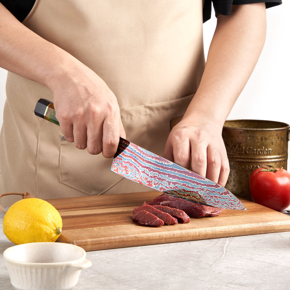 Person cutting meat on a wooden board with a knife, surrounded by vegetables.