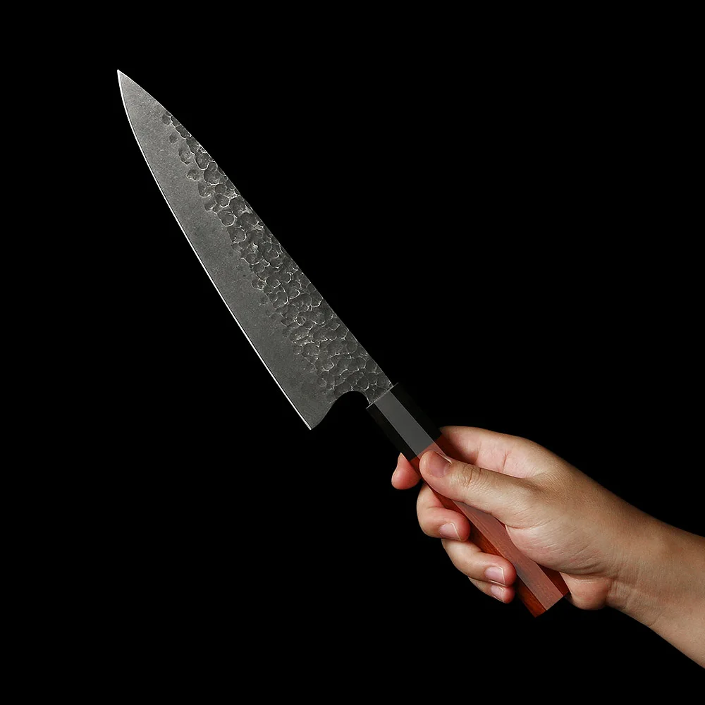 sharp japanese knife in the hands of chef