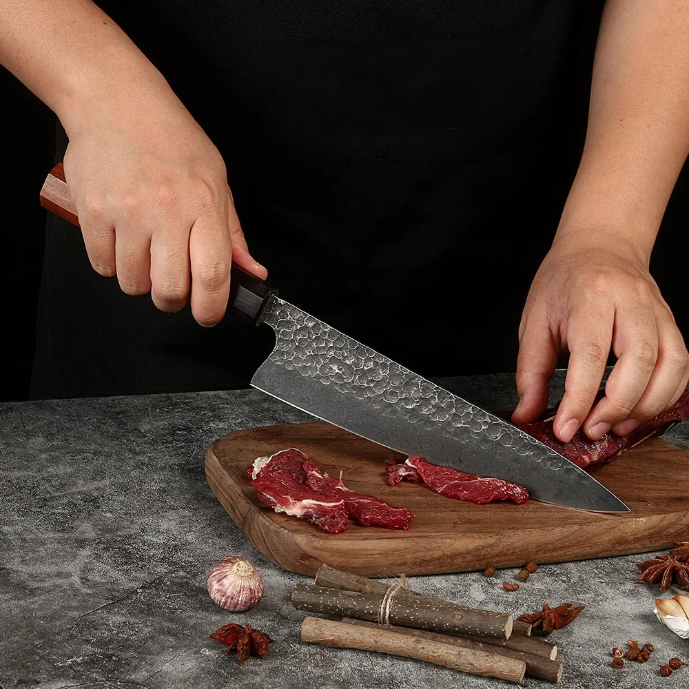 japanese chef slicing steak with premium kiritsuke knife