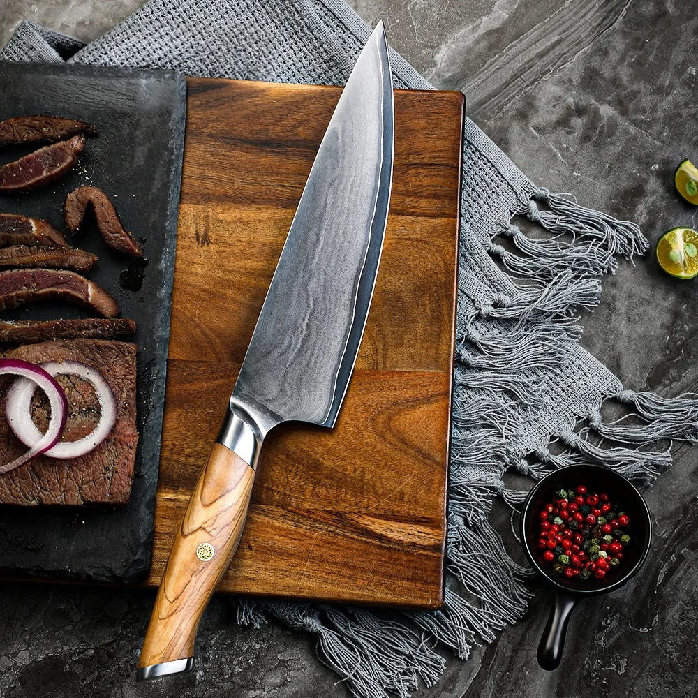 Chef Knife Precision slicing steak on cutting board with pepper and onions