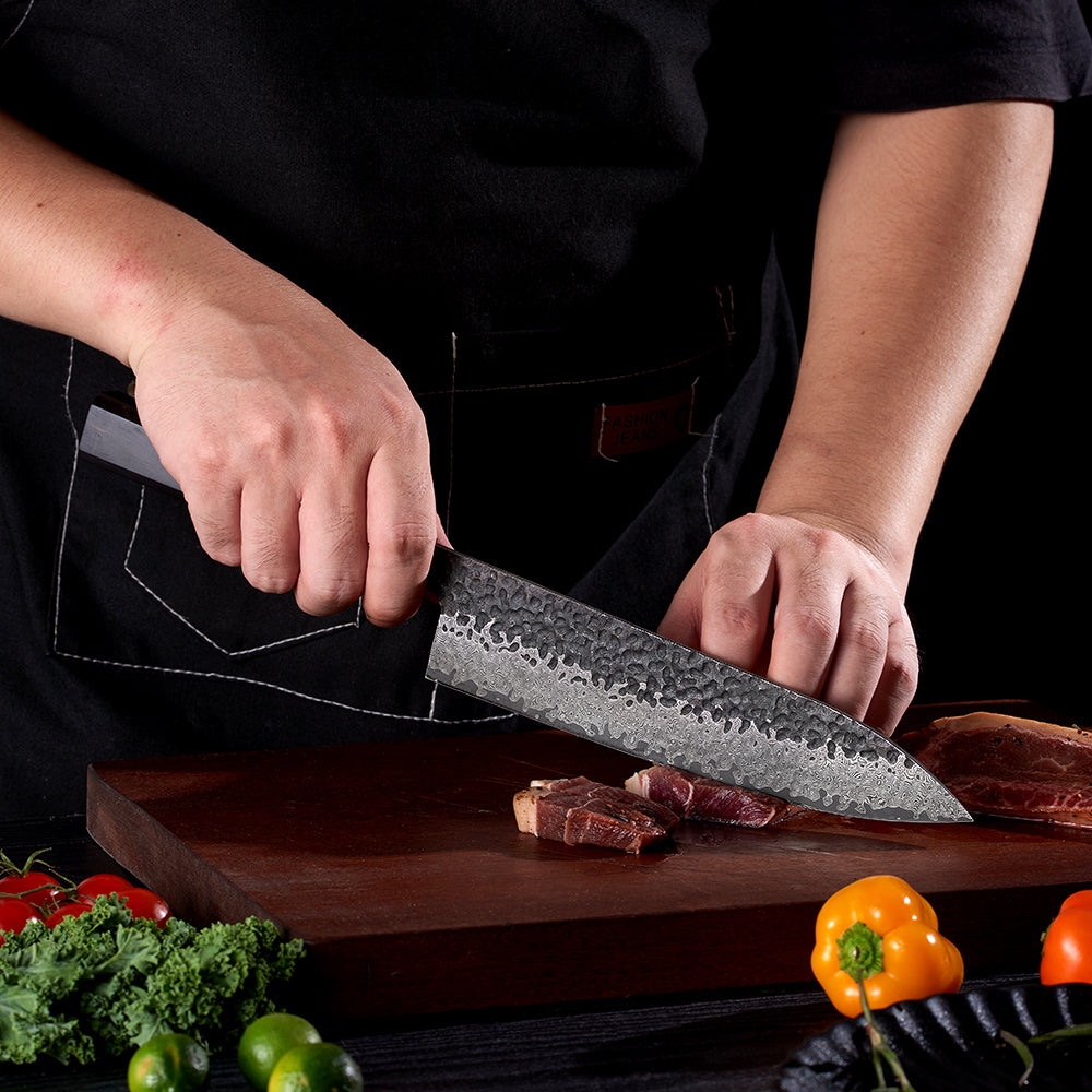 Japanese knife slicing steak with sharp japanese kitchen knife