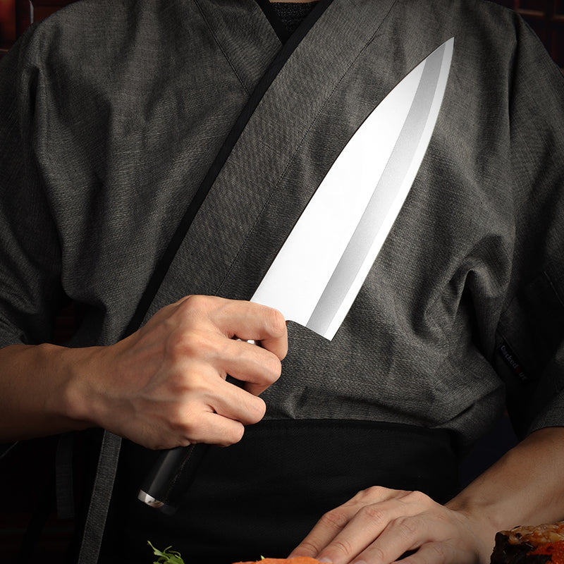 Chef holding a sharp and premium fish knife over a cutting board with food