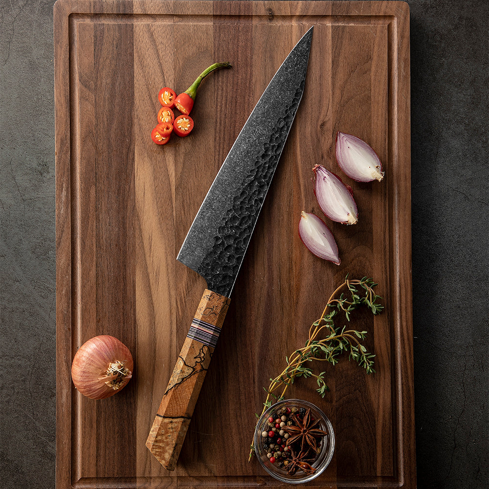 Kitchen japanese Knife on wooden cutting board with onions and pepper