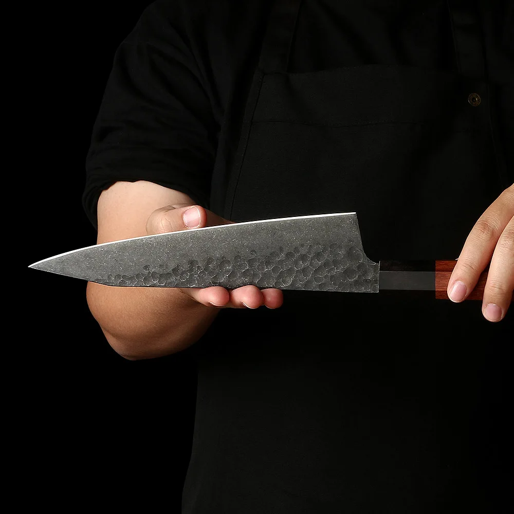 japanese knife in hands of japanese chef prepared to cut sushi