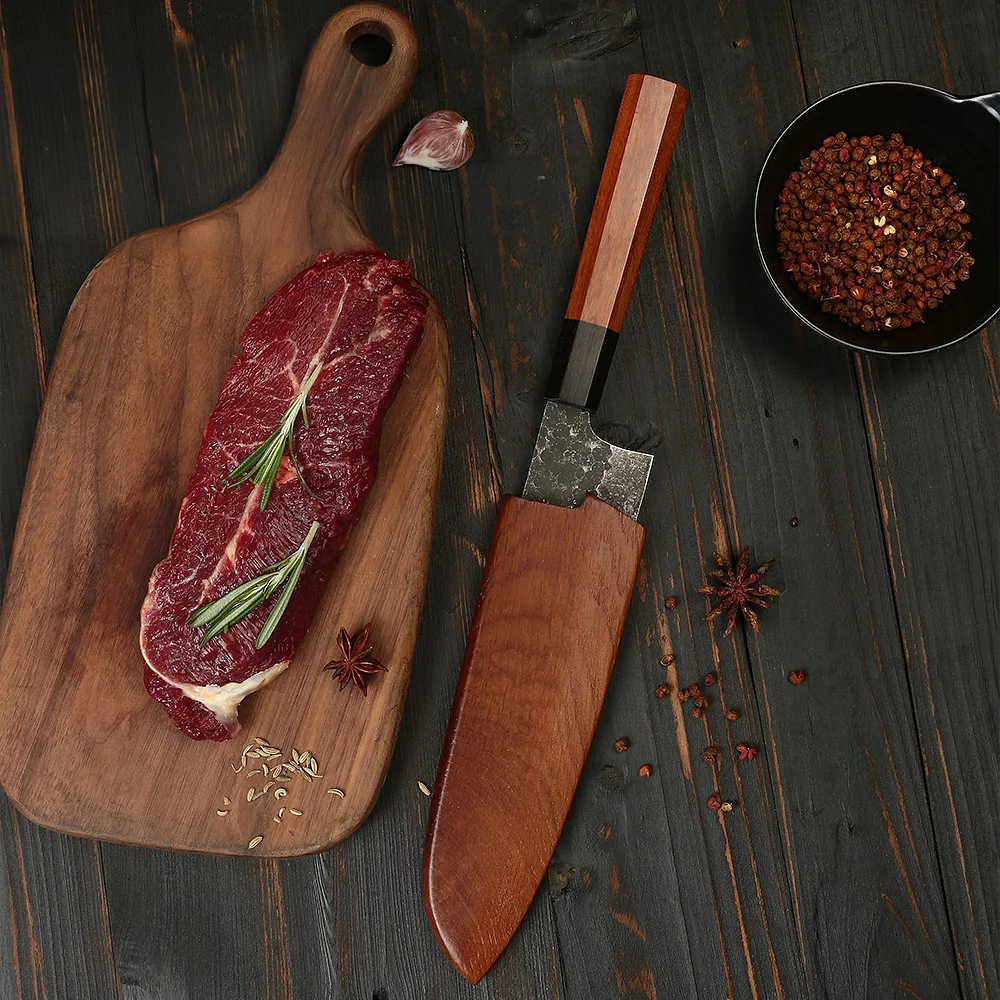 Japanese knife on a wooden table near food